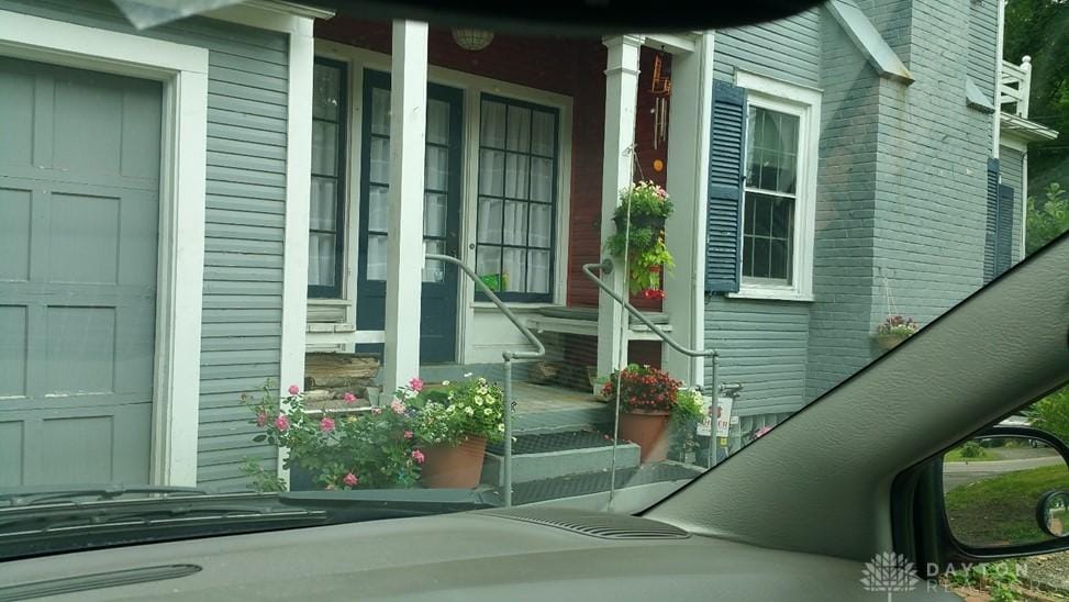 entrance to property featuring covered porch