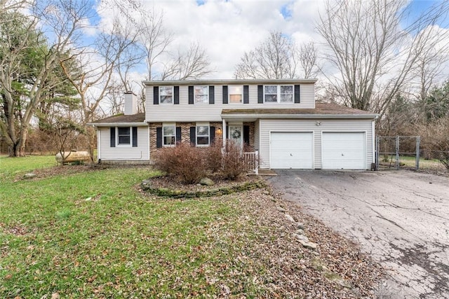 view of front of house with aphalt driveway, a garage, brick siding, fence, and a front lawn