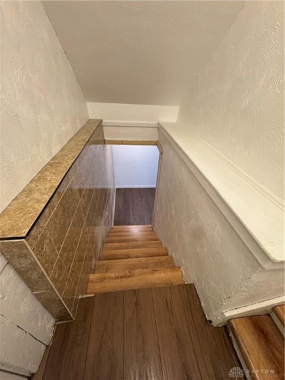 stairway with wood-type flooring