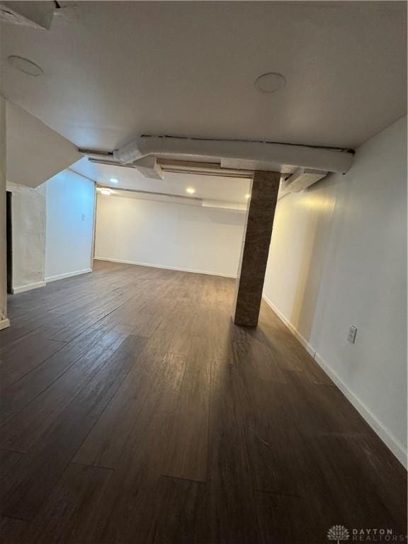 basement with dark wood-type flooring