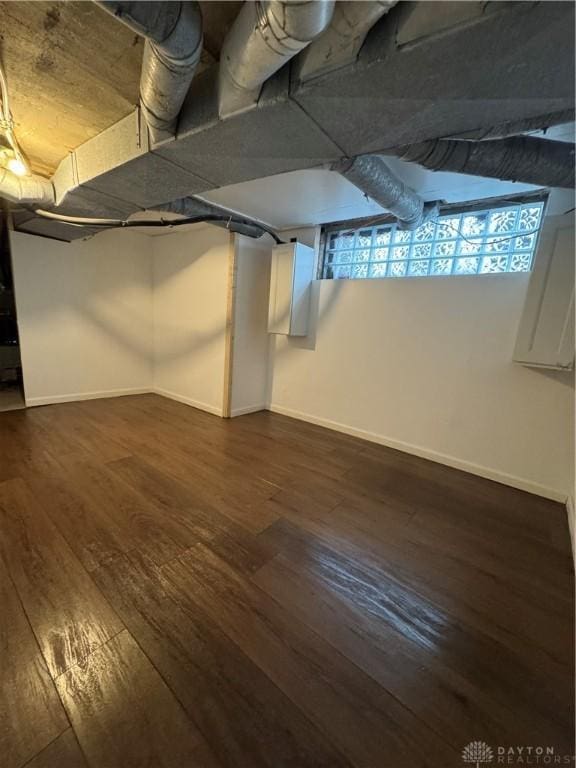 basement featuring dark wood-type flooring