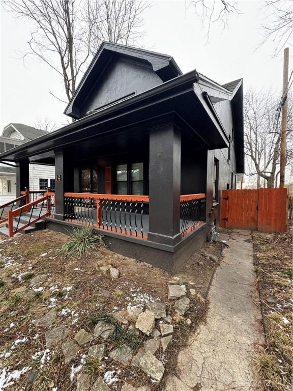 view of side of property featuring a porch