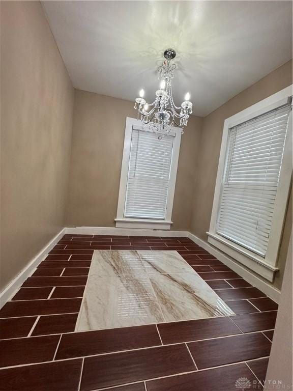 interior space featuring a notable chandelier