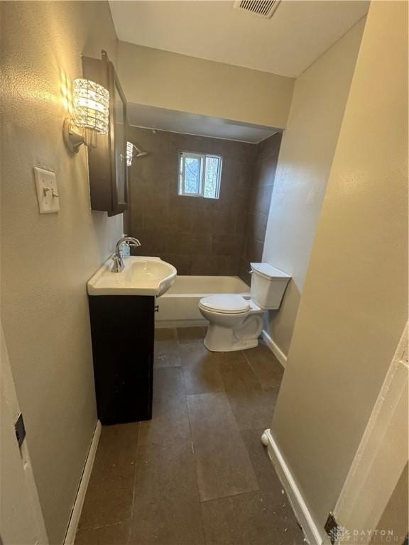 full bathroom with vanity, toilet, and tiled shower / bath combo