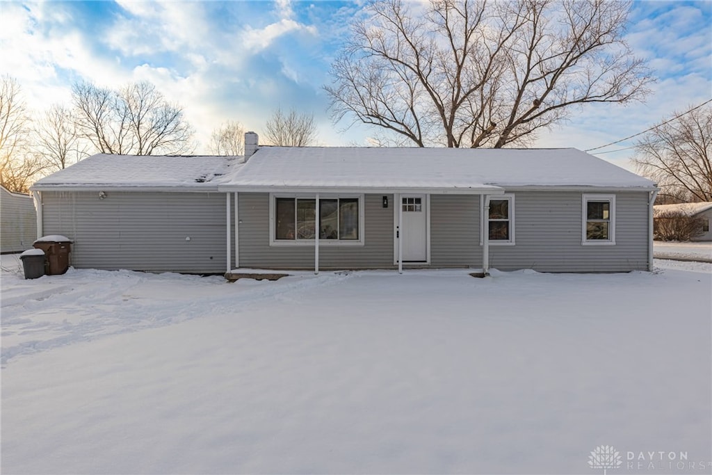 view of snow covered house