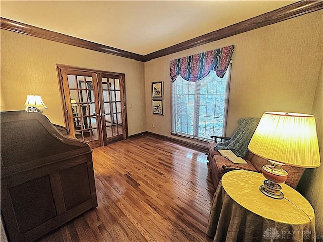 office space with french doors, crown molding, and wood-type flooring