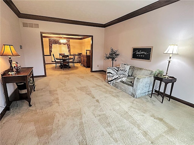 living room featuring ornamental molding and light carpet