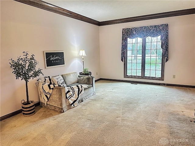 sitting room featuring carpet flooring and ornamental molding