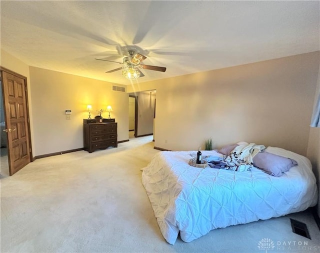 bedroom with light carpet and ceiling fan