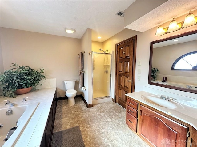 full bathroom with vanity, toilet, and separate shower and tub