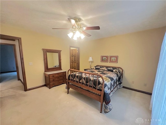 bedroom featuring ceiling fan and light colored carpet