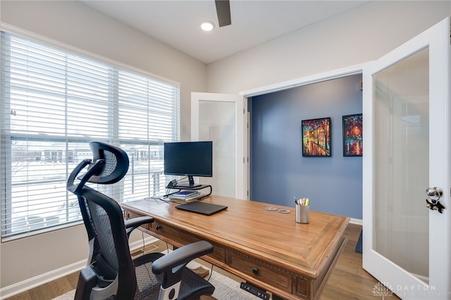 office area featuring a wealth of natural light, french doors, and hardwood / wood-style flooring