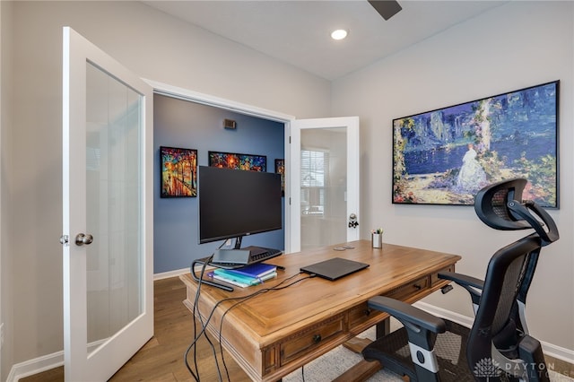 home office featuring french doors and hardwood / wood-style floors