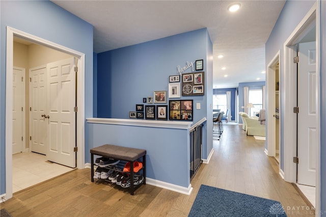 hall with light wood-type flooring