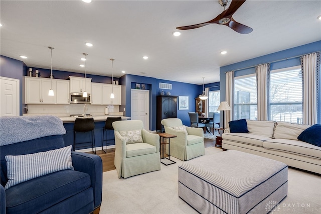 living room featuring ceiling fan