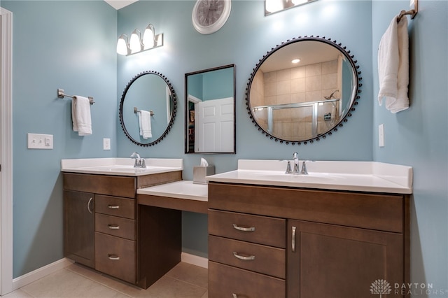 bathroom featuring vanity, tile patterned floors, and a shower with shower door