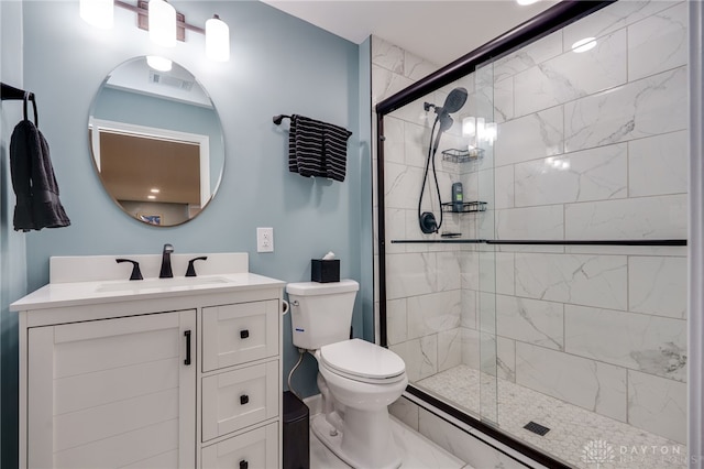 bathroom with vanity, toilet, and walk in shower