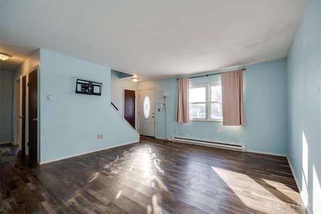 interior space with a baseboard heating unit and dark wood-type flooring