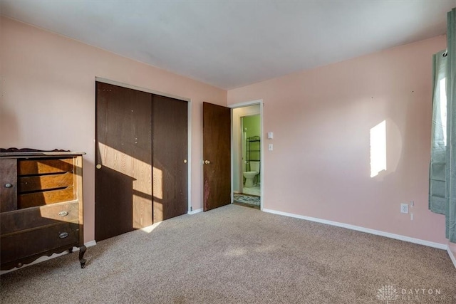 unfurnished bedroom with a closet and carpet