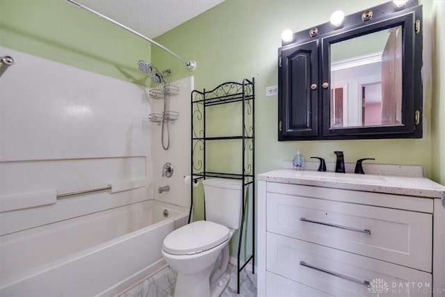 full bathroom featuring  shower combination, toilet, a textured ceiling, and vanity