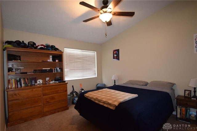 carpeted bedroom featuring ceiling fan and lofted ceiling