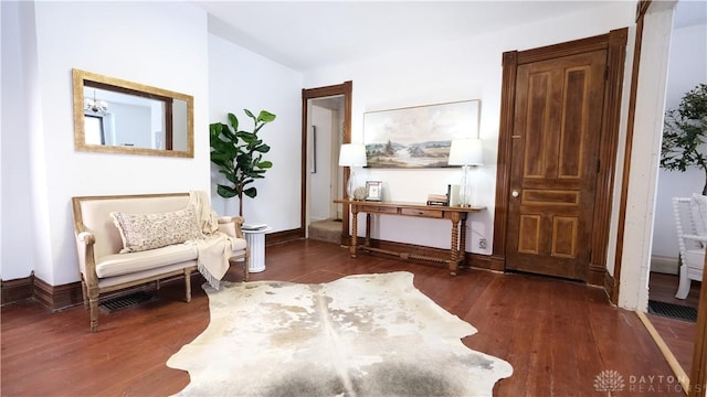 living area with dark hardwood / wood-style floors