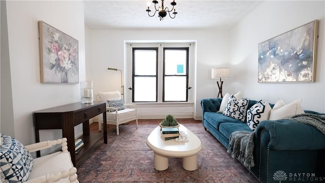 living room featuring a notable chandelier