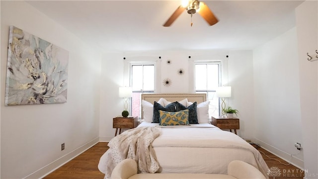 bedroom featuring ceiling fan and dark hardwood / wood-style floors