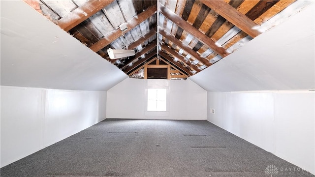 additional living space with carpet floors and lofted ceiling