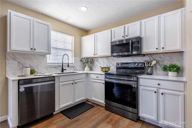 kitchen featuring white cabinetry, sink, and stainless steel appliances