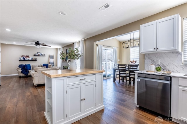 kitchen with wooden counters, white cabinetry, stainless steel dishwasher, and ceiling fan