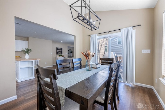 dining area with dark hardwood / wood-style flooring