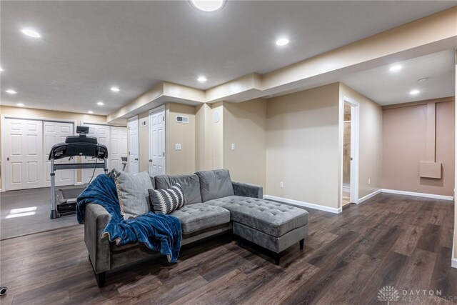 living room with dark hardwood / wood-style floors