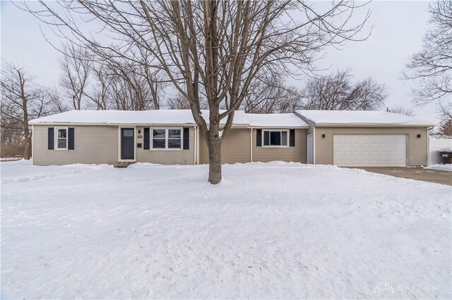 single story home featuring a garage