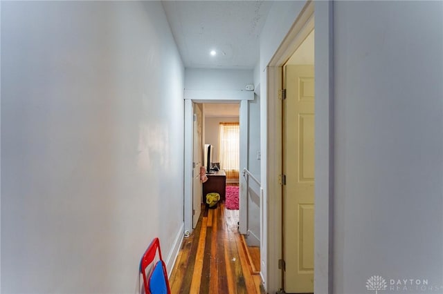 corridor featuring dark hardwood / wood-style floors