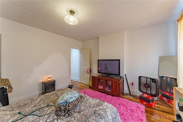 bedroom featuring wood-type flooring