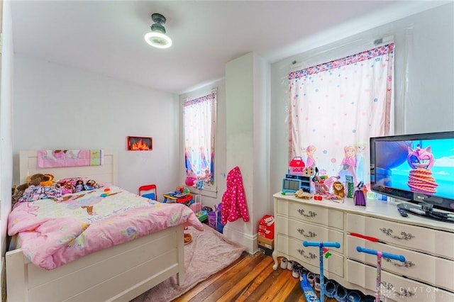 bedroom with hardwood / wood-style flooring