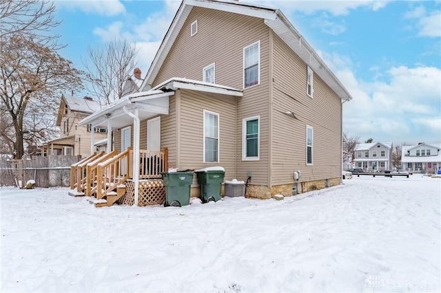 view of snow covered house