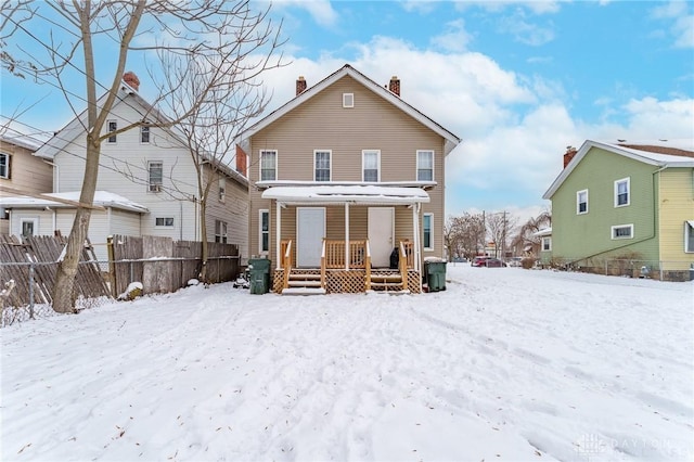 view of snow covered house