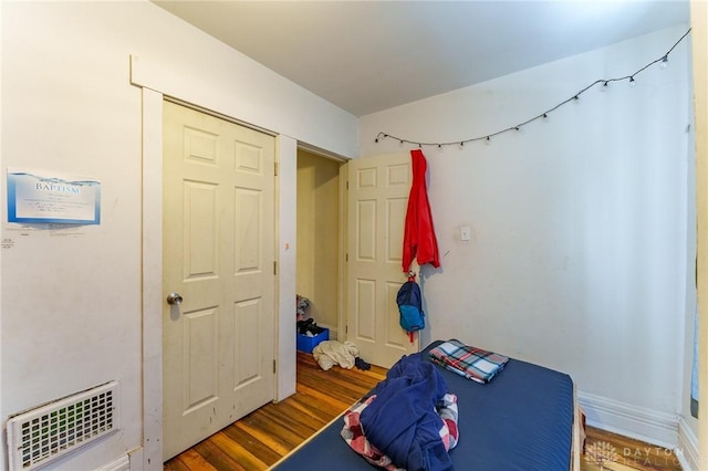 bedroom featuring wood-type flooring