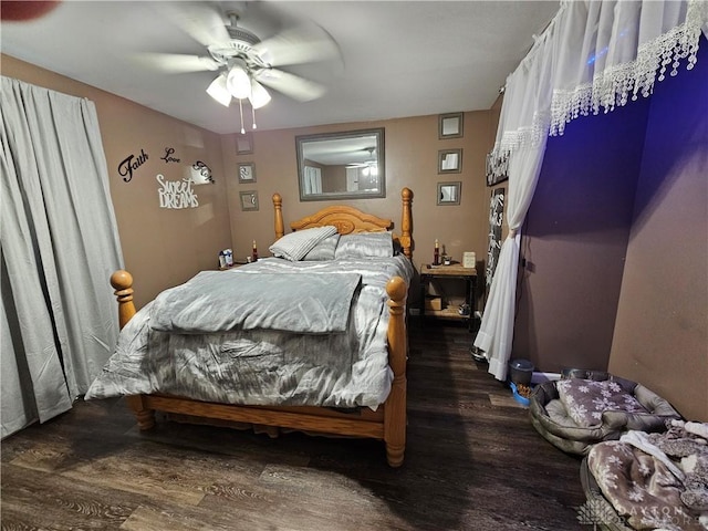 bedroom featuring dark hardwood / wood-style flooring and ceiling fan