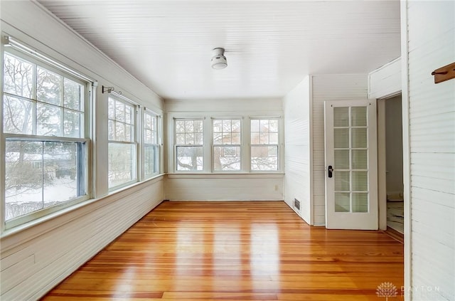 unfurnished sunroom with a wealth of natural light