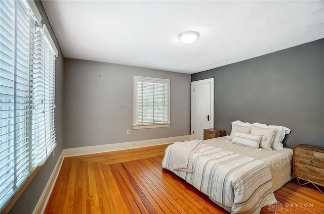 bedroom with hardwood / wood-style floors