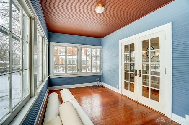 unfurnished sunroom with french doors