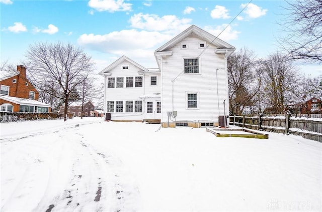 view of snow covered house