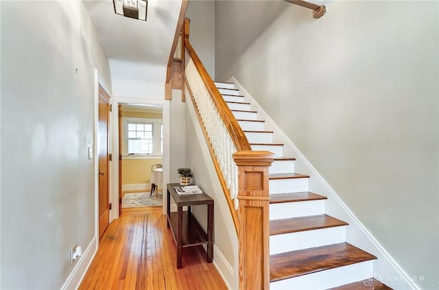 staircase with wood-type flooring