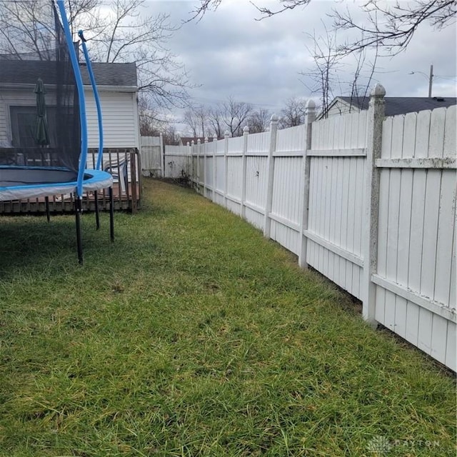 view of yard featuring a trampoline