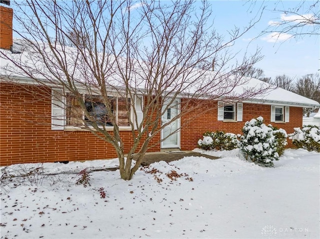 view of snow covered property