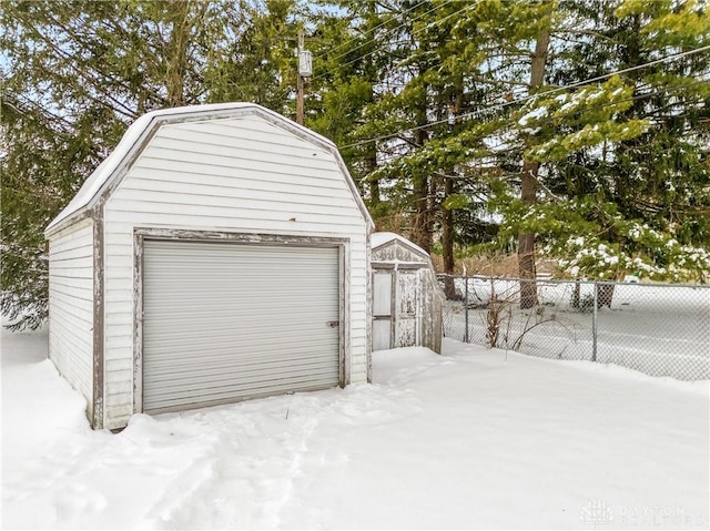 view of snow covered garage