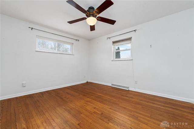 empty room featuring hardwood / wood-style flooring and ceiling fan